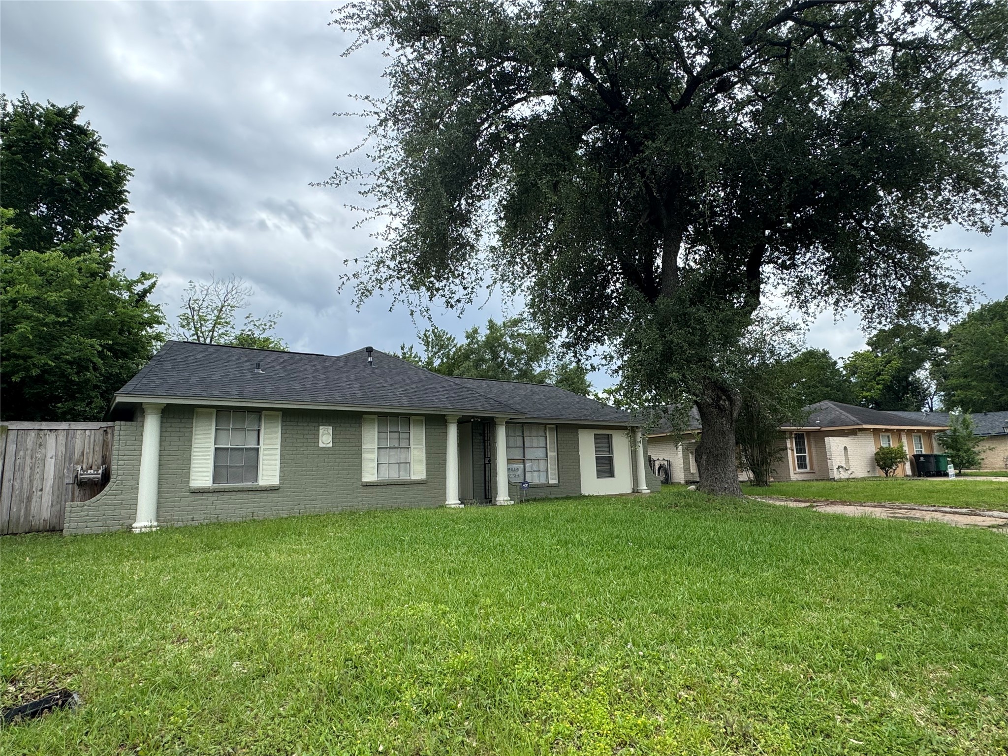 1443 Willow Rock Road Houston, TX 77088 - Photo 2 of 27 a front view of a house with a garden