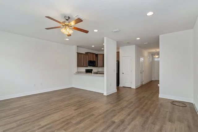 a view of a kitchen with a sink and a window