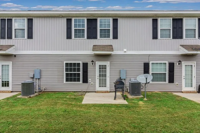 a house view with a sitting space garden view with a large window