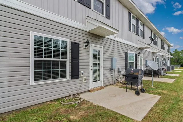 a house view with a sitting space and garden space