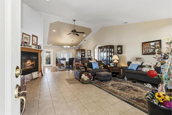 a living room with furniture and a fireplace