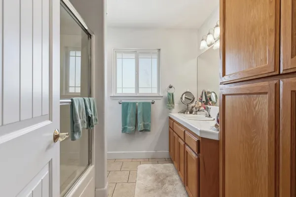 a bathroom with a sink a mirror and a bathtub