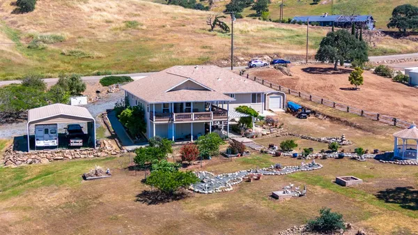 a view of living room with furniture and a mirror