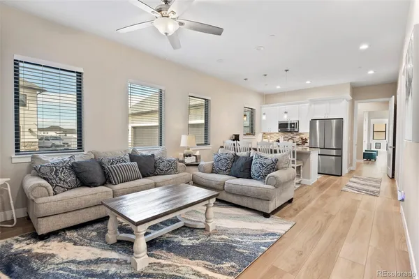 a living room with furniture and a table