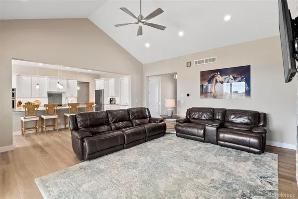 a living room with furniture or couch and a dining table