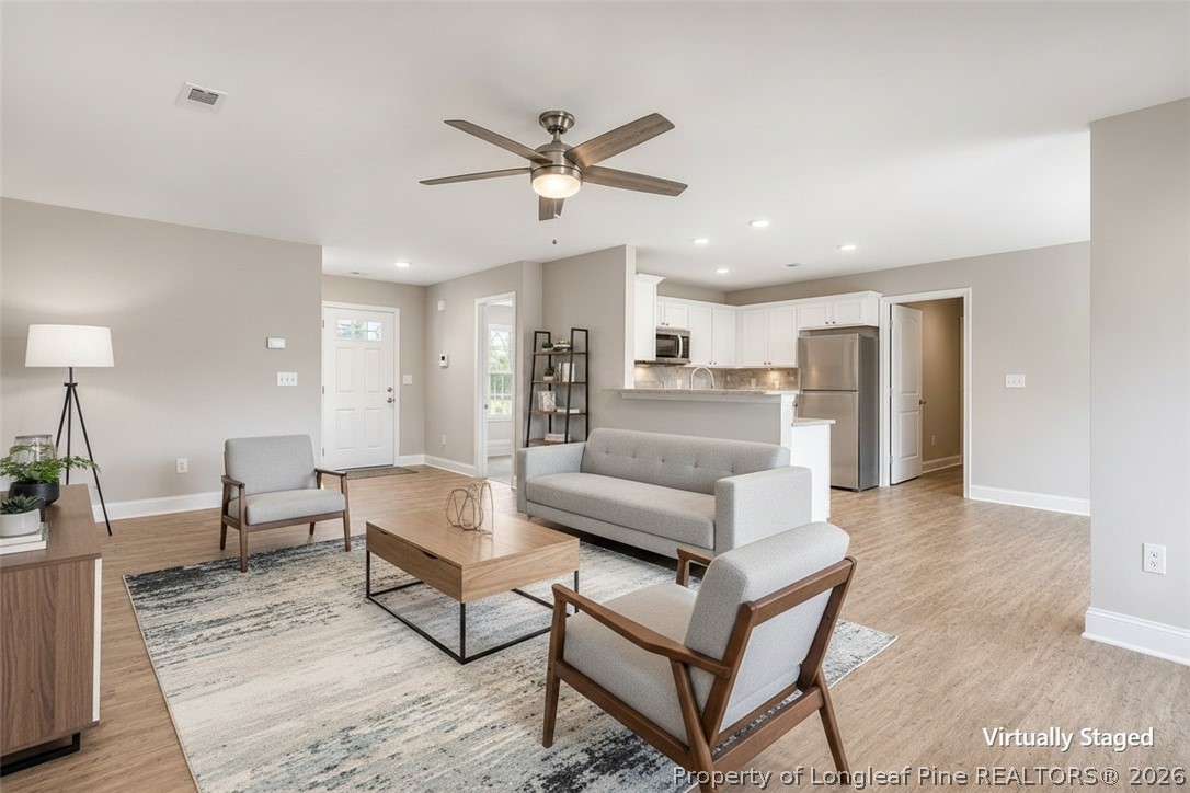756 Jordan Road Autryville, NC 28318 - Photo 23 of 34 a living room with furniture and kitchen view