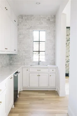 a white tub sitting next to a bathroom