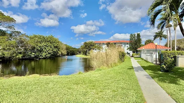 a view of a lake with a big yard