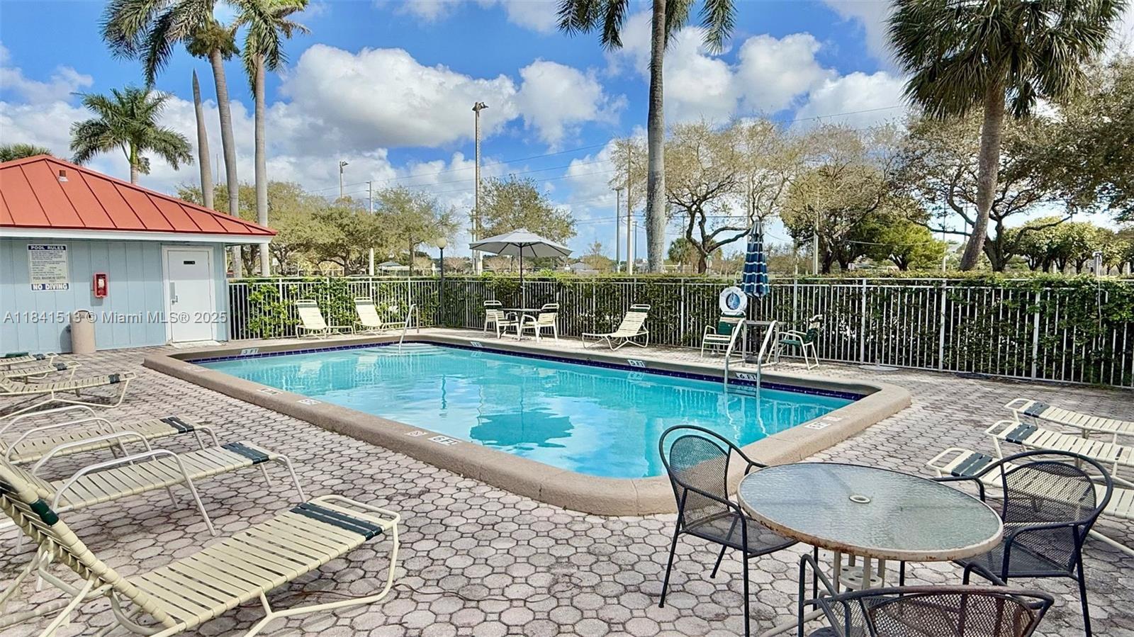 605 South Pine Island Road, Unit 405A Plantation, FL 33324 - Photo 14 of 17 a view of swimming pool with outdoor seating and plants