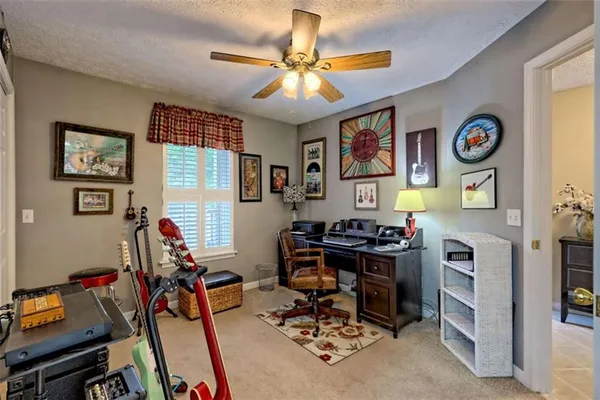 front view of a brick house with a small yard