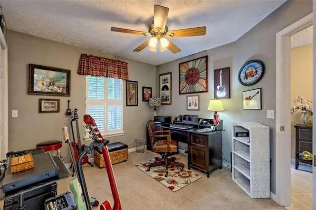 front view of a brick house with a small yard