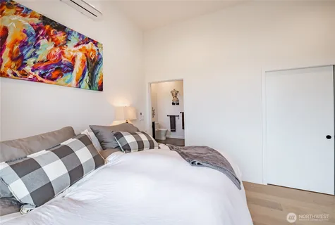 a living room with furniture and a mirror