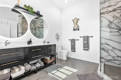 a bathroom with a sink vanity and mirror