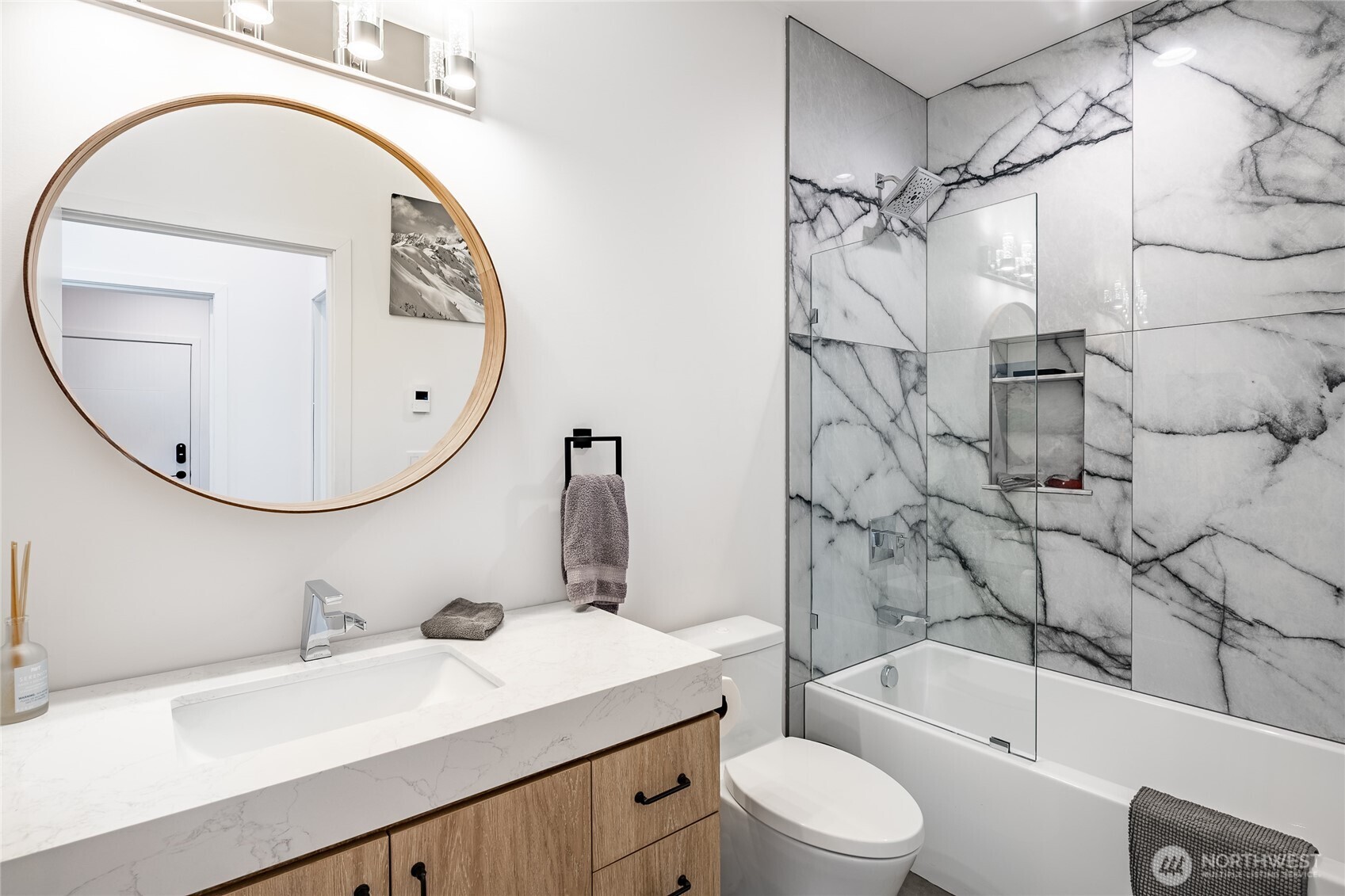 8068 Niska Road Blaine, WA 98230 - Photo 16 of 40 a bathroom with a sink a toilet and a mirror