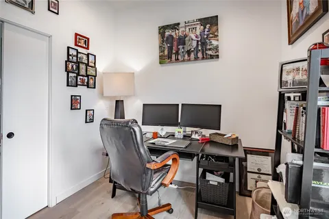 a view of a living room and dining room with furniture
