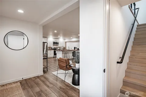 a living room with furniture and kitchen view