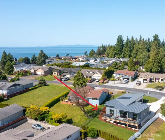 a front view of a house with outdoor seating