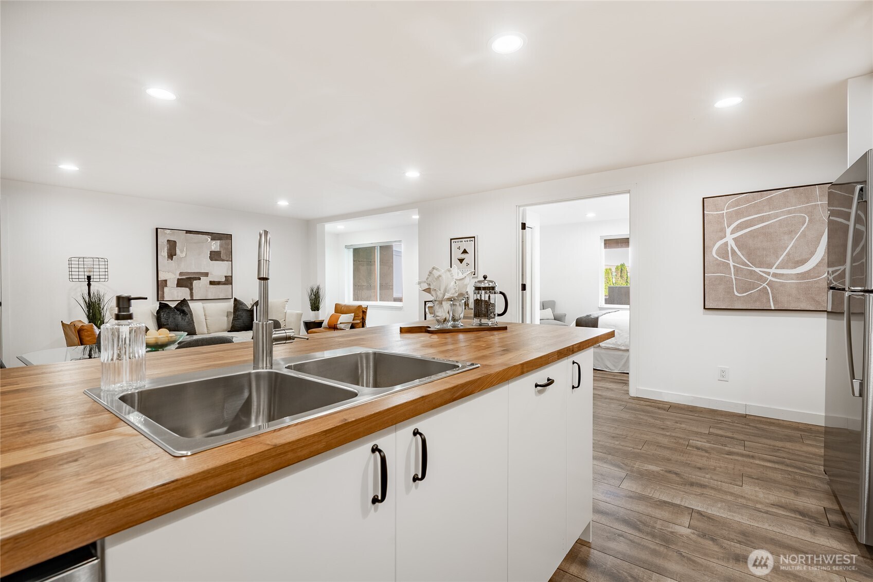 8068 Niska Road Blaine, WA 98230 - Photo 23 of 40 a large kitchen with lots of counter space and wooden floor