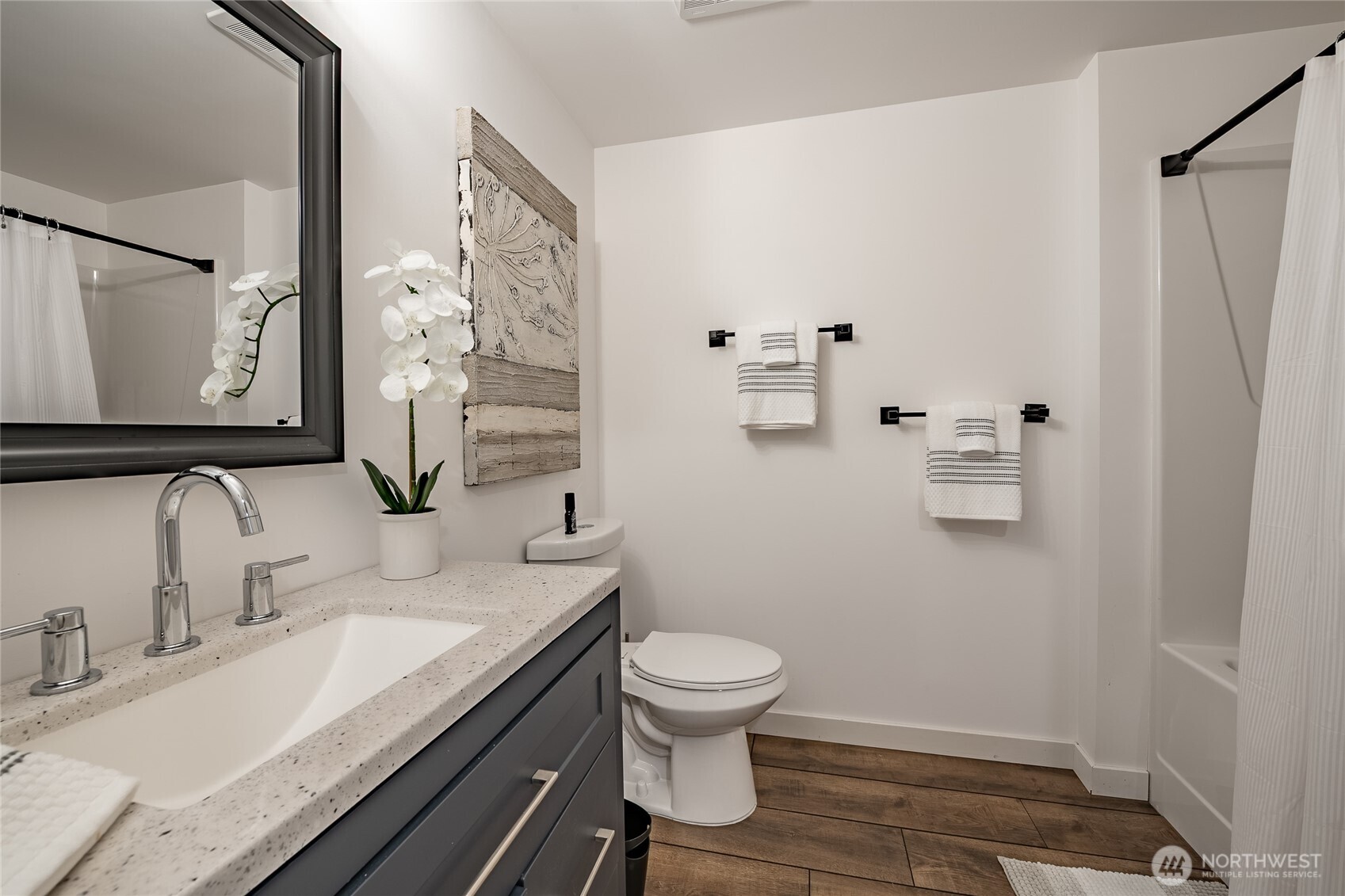 8068 Niska Road Blaine, WA 98230 - Photo 25 of 40 a bathroom with a granite countertop sink toilet and shower