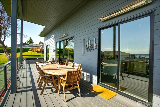 a backyard of a house with barbeque oven and outdoor seating