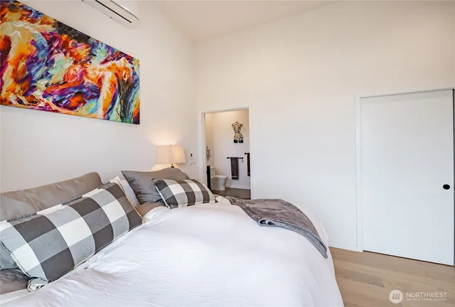 a living room with furniture and a mirror