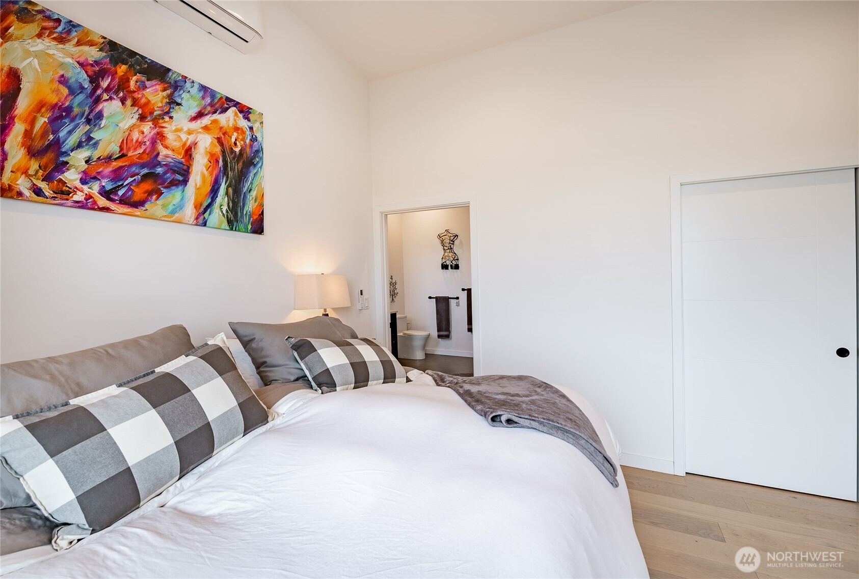 8068 Niska Road Blaine, WA 98230 - Photo 10 of 40 a bedroom with a bed and painting on the wall