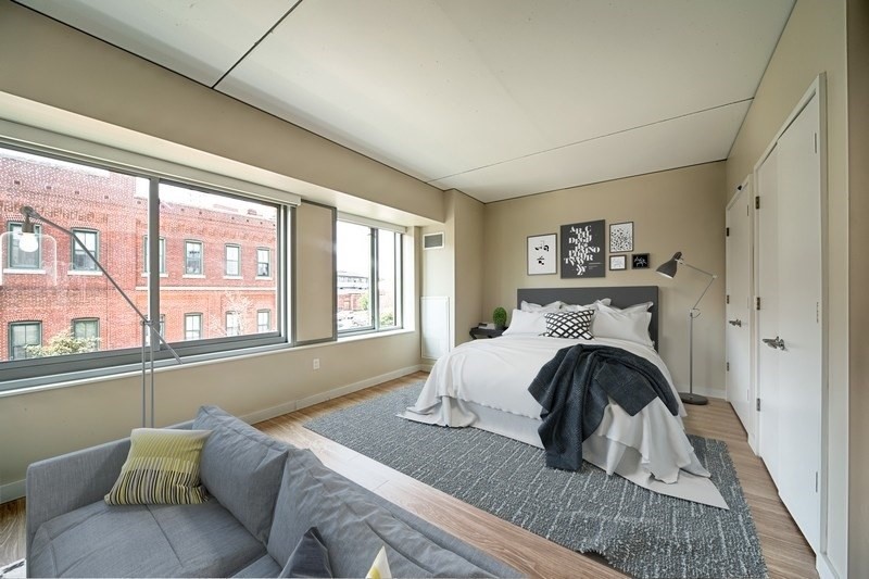 270 Third Street, Unit 505 Cambridge, MA 02142 - Photo 2 of 9 a living room with furniture and a large window