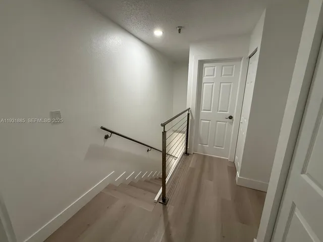 a view of hallway with stairs