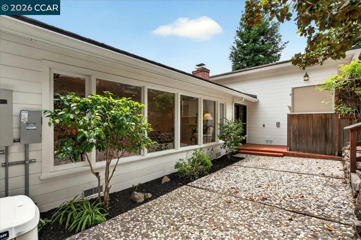 24 Las Vegas Road Orinda, CA 94563 - Photo 4 of 47 a front view of a house with garden
