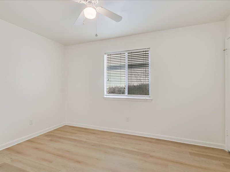 817 Smoke Signal Pass Pflugerville, TX 78660 - Photo 7 of 10 Unfurnished room featuring light wood finished floors and ceiling fan
