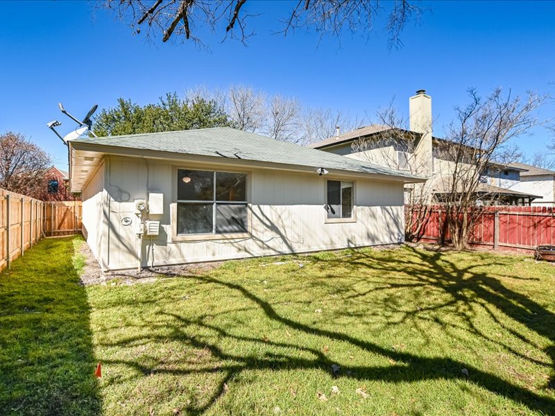 817 Smoke Signal Pass Pflugerville, TX 78660 - Photo 10 of 10 Rear view of property with a fenced backyard, a chimney, and roof with shingles