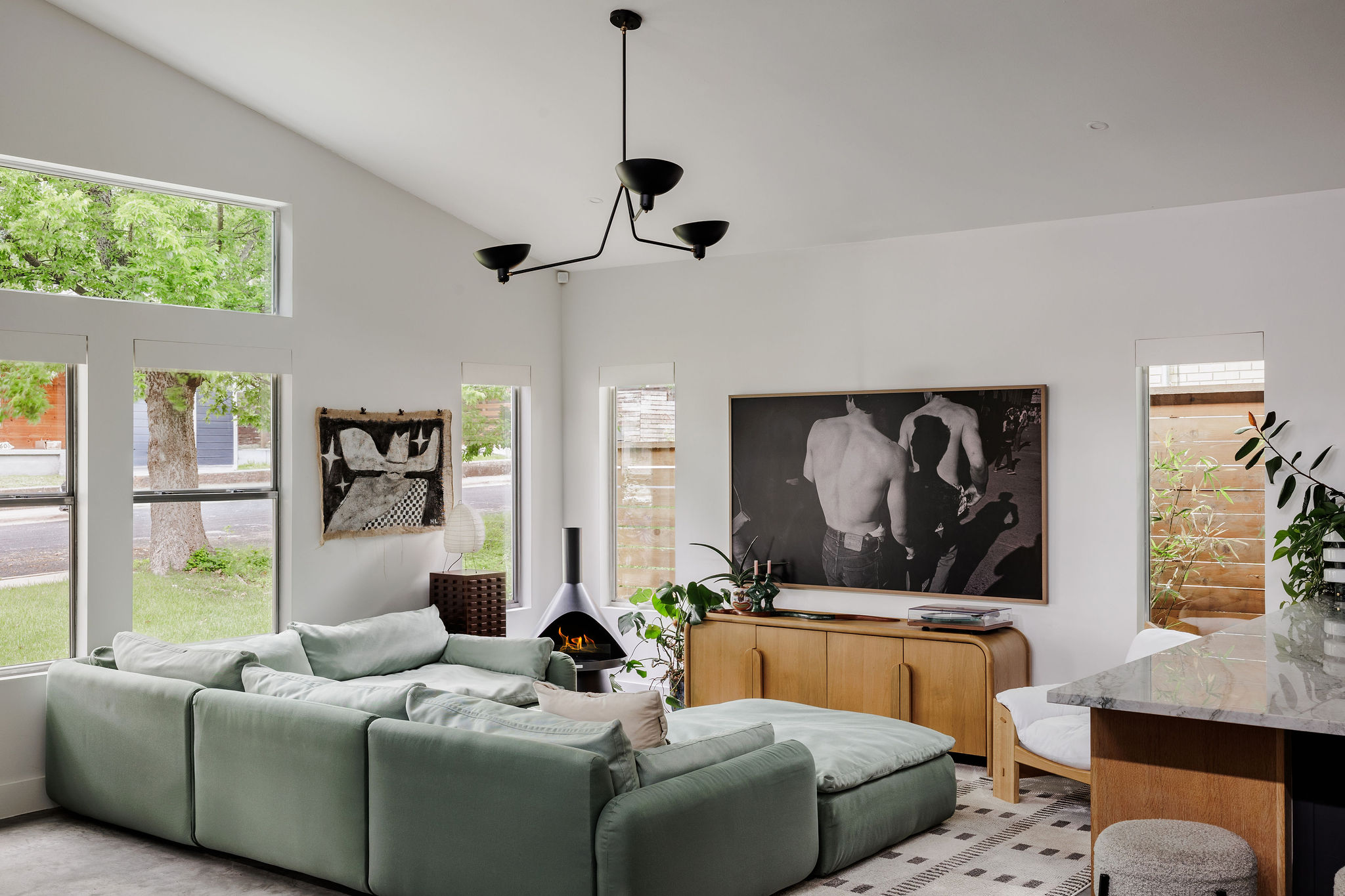 1605 Maple Avenue Austin, TX 78702 - Photo 6 of 33 Vaulted ceiling living area featuring multiple windows