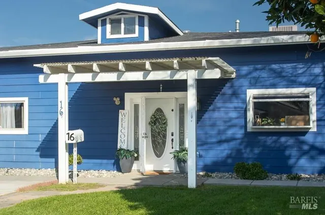a front view of a house with garden
