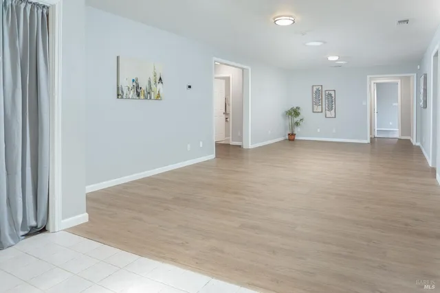 a view of an empty room with a painting