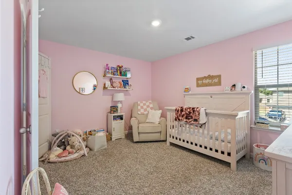 a bedroom with furniture and a bed