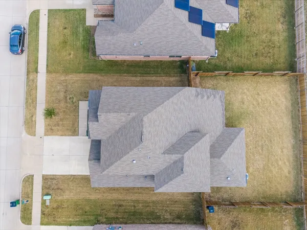 an aerial view of residential house with outdoor space