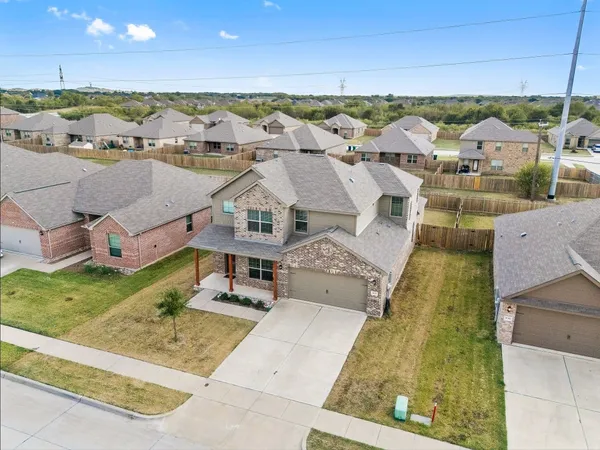 an aerial view of a house with a garden