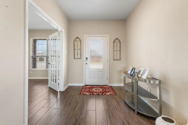 a very nice looking room with wooden floor