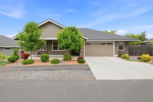 front view of a house with a small yard