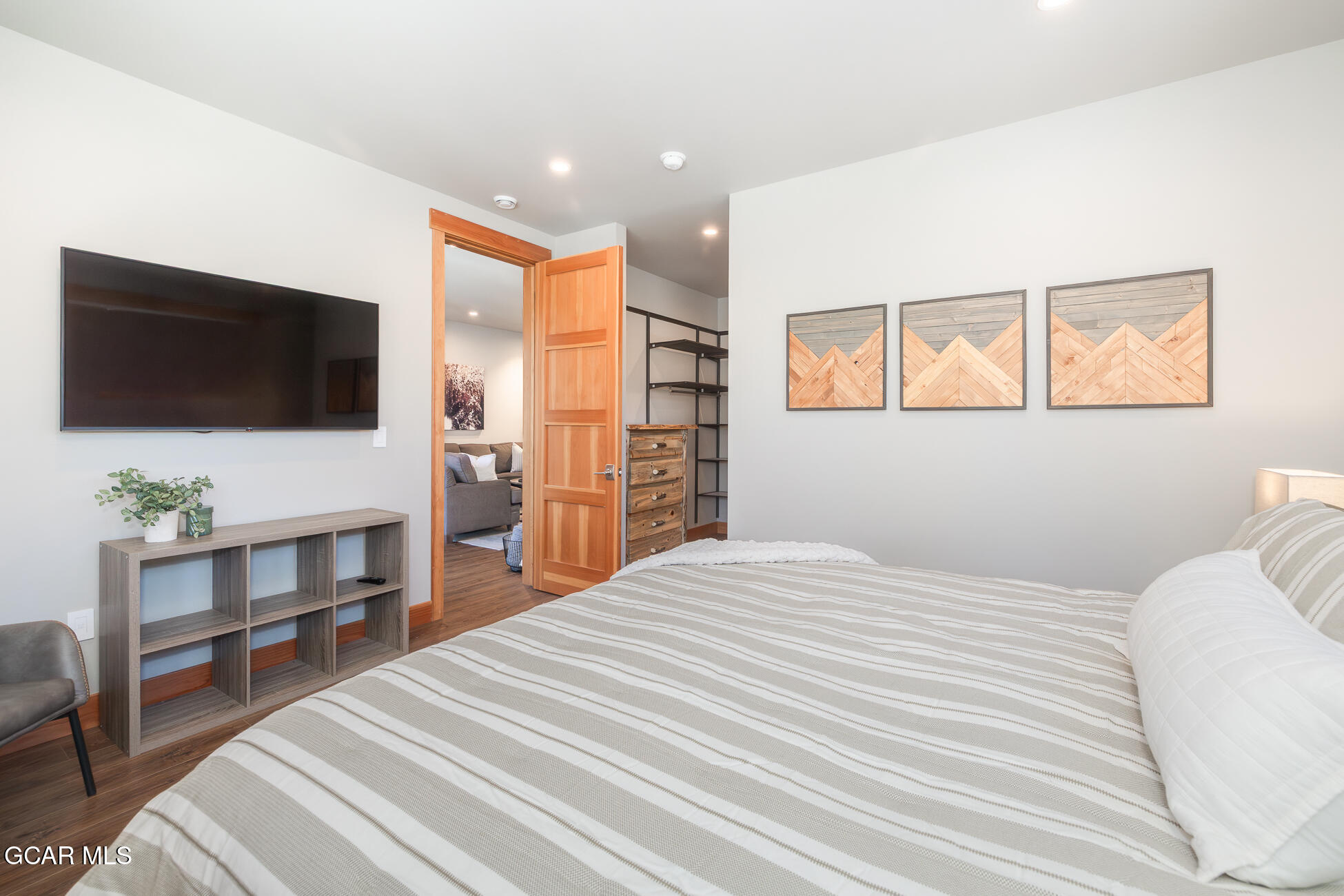 684 Vasquez Road Winter Park, CO 80482 - Photo 27 of 45 a bedroom with a bed and a flat screen tv