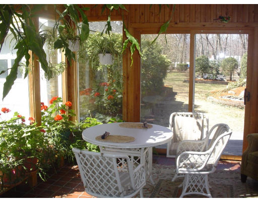 63 Spring Street Lexington, MA 02421 - Photo 11 of 14 a view of a dining room with furniture window and outside view