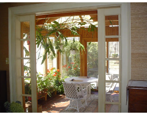 63 Spring Street Lexington, MA 02421 - Photo 13 of 14 a view of a glass door with a outdoor space