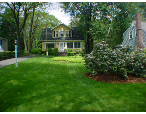 63 Spring Street Lexington, MA 02421 - Photo 14 of 14 a front view of a house with a yard
