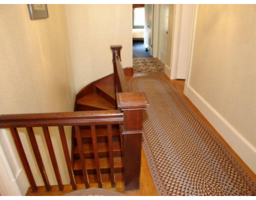 63 Spring Street Lexington, MA 02421 - Photo 3 of 14 a view of wooden floor in a corridor