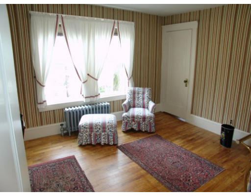63 Spring Street Lexington, MA 02421 - Photo 9 of 14 a bedroom with a bed and a window
