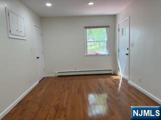 64 East Century Road Paramus, NJ 07652 - Photo 14 of 19 an empty room with wooden floor and windows