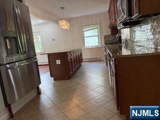 64 East Century Road Paramus, NJ 07652 - Photo 5 of 19 a kitchen with stainless steel appliances granite countertop a refrigerator a stove and a sink