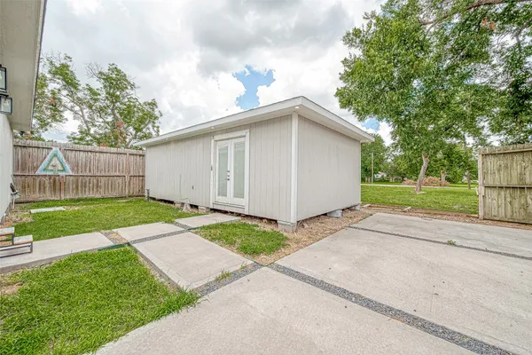 a view of backyard of house with garage