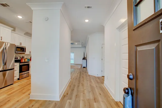 a view of a kitchen from the hallway