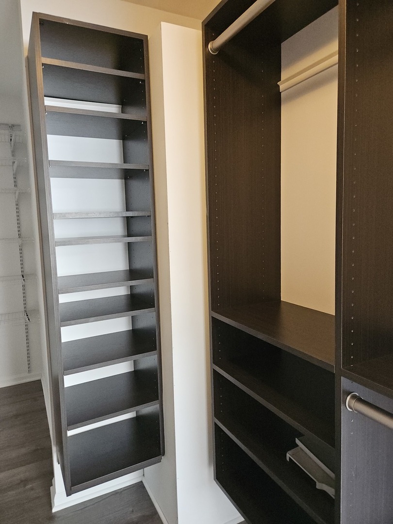 2011 Maplewood Circle Naperville, IL 60563 - Photo 18 of 43 a view of walk in closet with empty racks